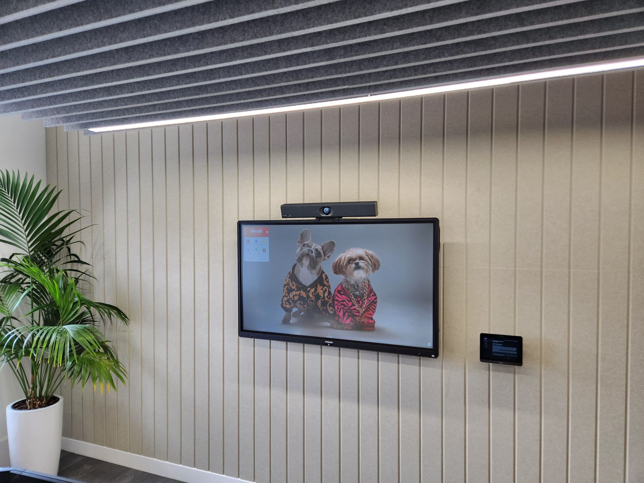 Ofgem with CTouch screen in a room with panels image